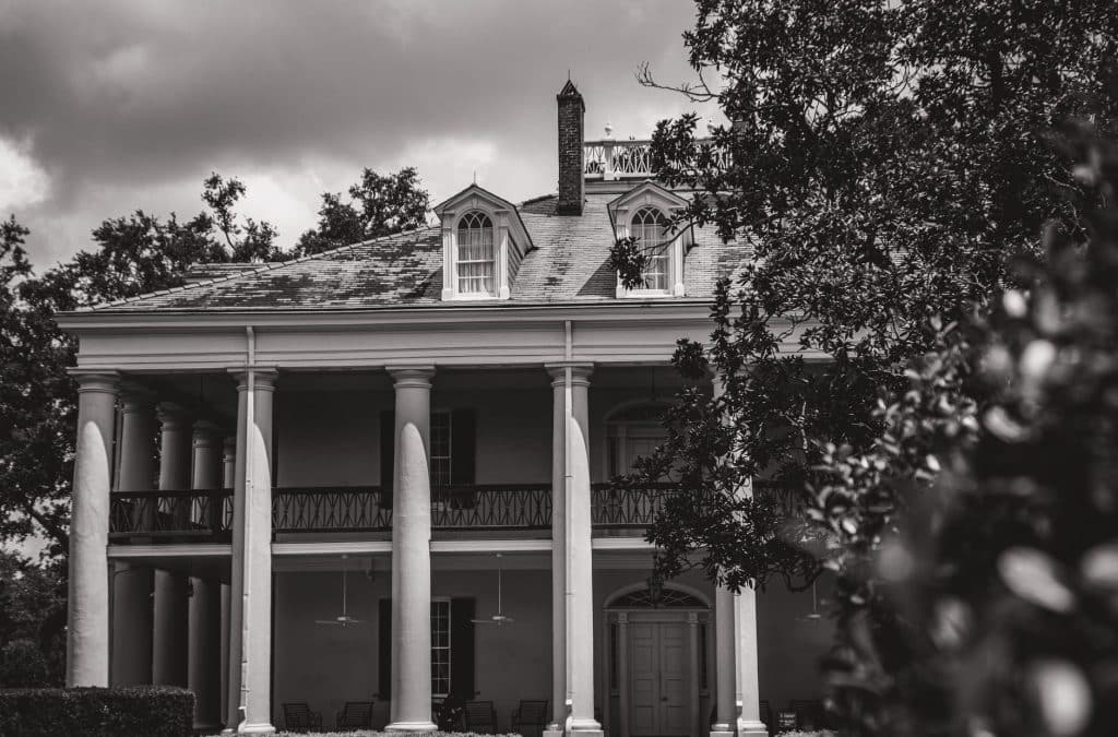 Historic columned house with a two-story gallery, a style seen around New Orleans