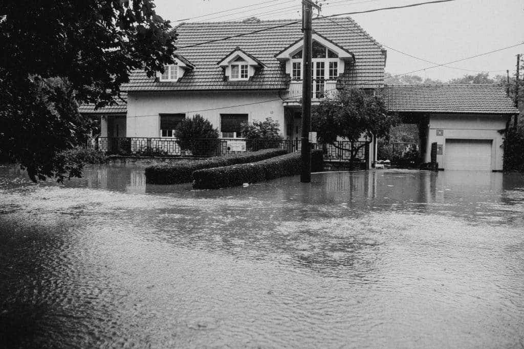 Floodwater surrounding a house during a storm, the kind of flooding Louisiana hurricane claims sort out