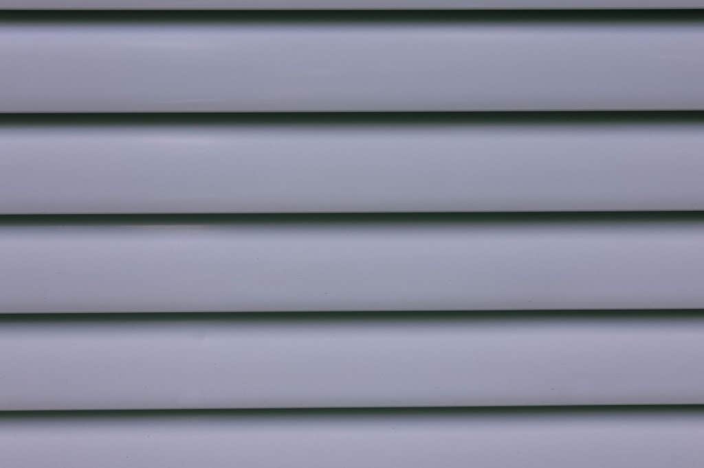 Close-up of gray horizontal vinyl siding panels, for Metairie homeowners